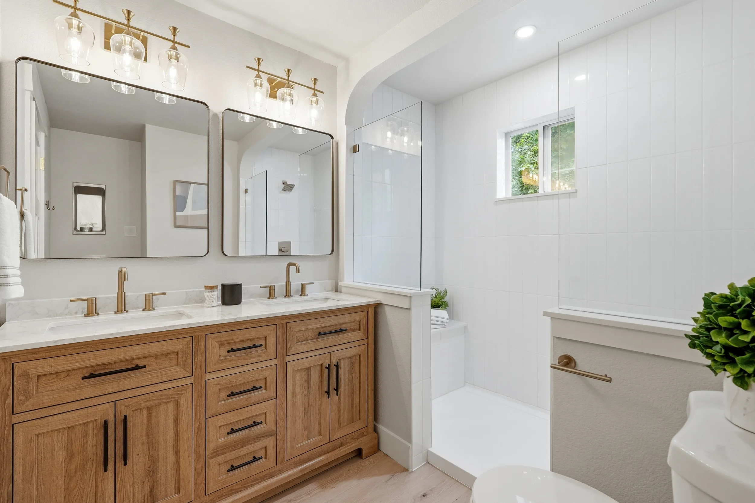 Primary bathroom with a walk-in shower and double vanity