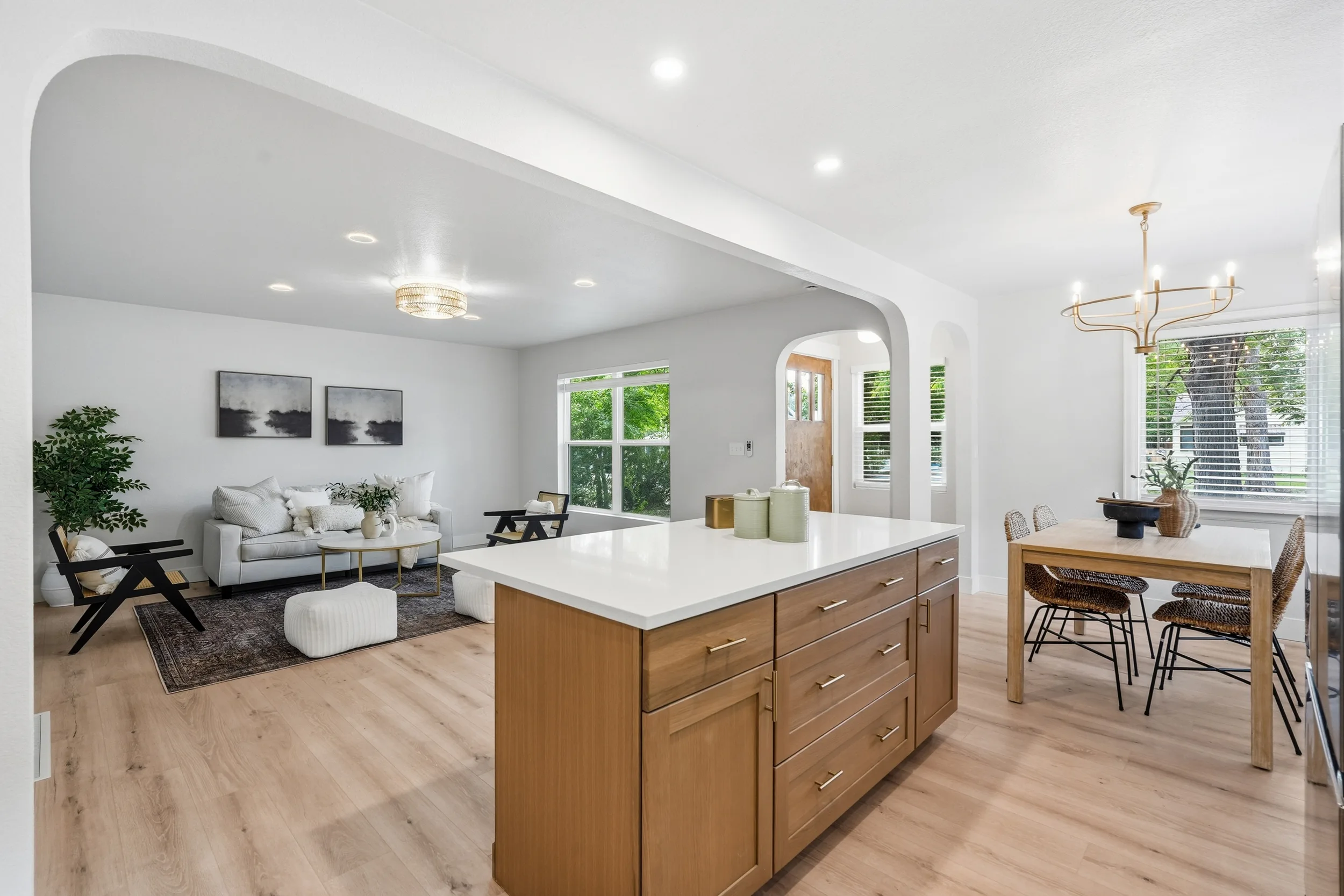 Living room, kitchen island and dining area
